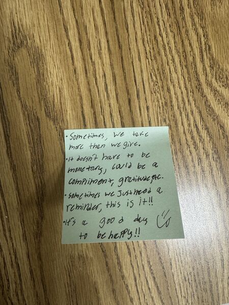Handwritten sticky note with words of encouragement